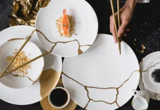 Kintsugi, the Japanese art of repairing broken pottery by joining pieces back together and filling cracks with lacquer dusted with powdered gold, silver, or platinum.
