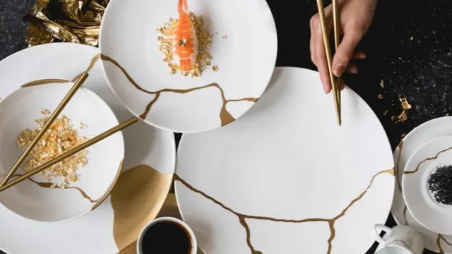 Kintsugi, the Japanese art of repairing broken pottery by joining pieces back together and filling cracks with lacquer dusted with powdered gold, silver, or platinum.