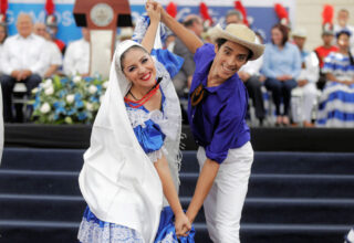 Traditional Salvadoran folk costumes worn during a cultural celebration