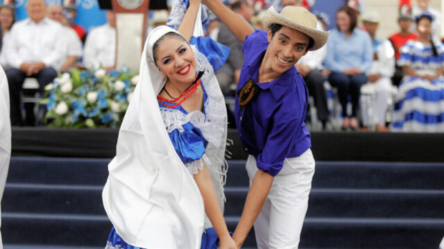 Traditional Salvadoran folk costumes worn during a cultural celebration