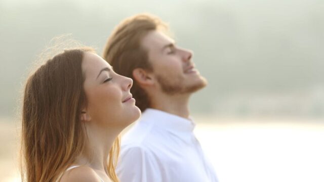 Couple breathing fresh air outdoors, a personal development practice