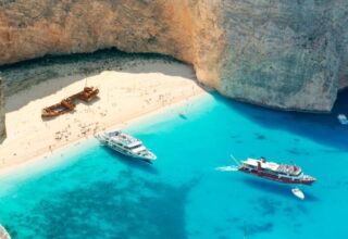 A shipwreck sits stoically on this stunning beach located on the northwest coast of Zakynthos.