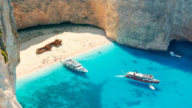A shipwreck sits stoically on this stunning beach located on the northwest coast of Zakynthos.