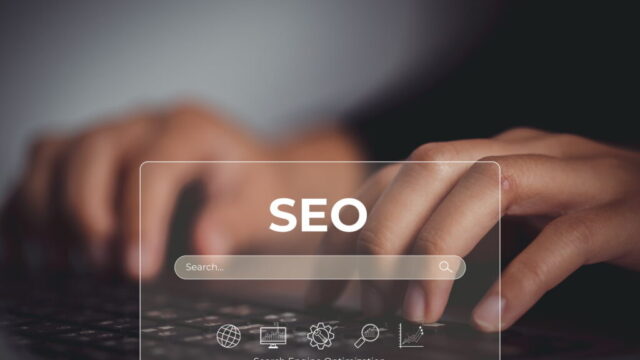 SEO concept with search engine optimization elements over a laptop
