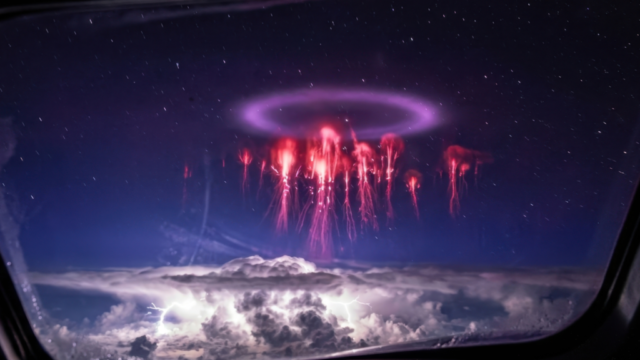 Red sprites and elve ring plasma discharge above thunderstorm captured from aircraft window — Earth's atmospheric electrical circuit visible